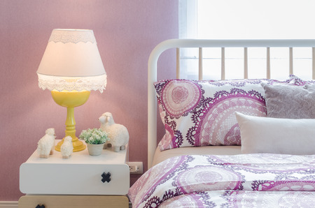 white classic lamp style with dolls on table side in kid's bedroom at homeの写真素材