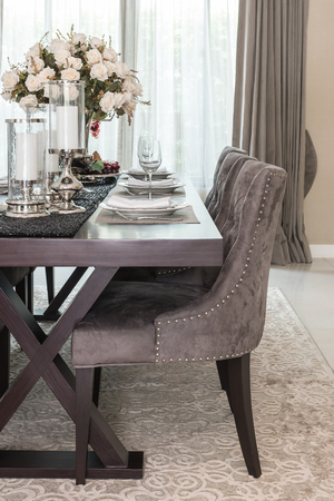 luxury dinning room with wooden table and classic style chair on carpetの写真素材