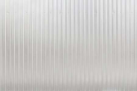 corrugated sheet metal, reflecting lightの写真素材