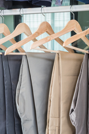 plants hanging on coat hanger in wardrobeの写真素材