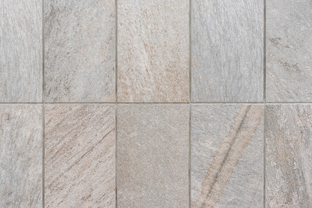 natural sand stone tile wall seamless background and textureの写真素材