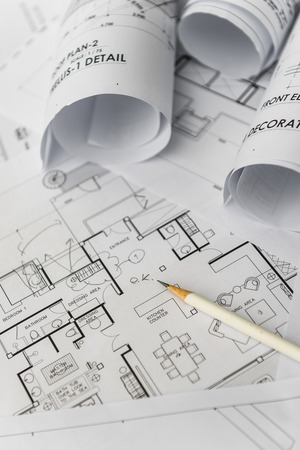 white pencil on architectural for construction drawings  with roll of blueprintの写真素材