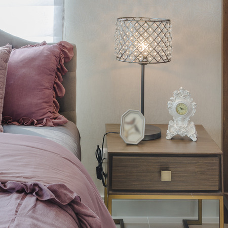 classic lamp style on wooden table side in bedroom at homeの写真素材