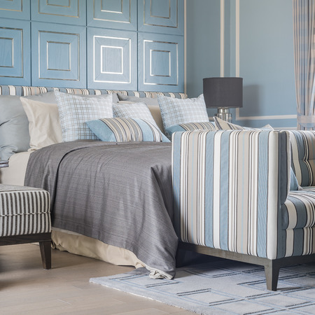 luxury sofa and bed in classic blue bedroom styleの写真素材