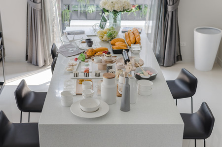 set of dessert on white dinning table at home
