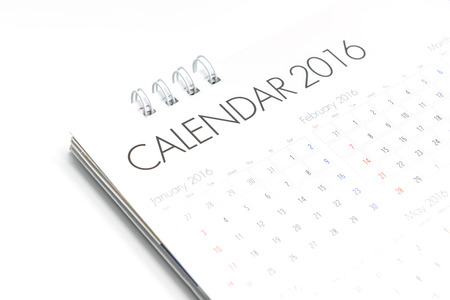 White paper desk spiral calendar 2016 on white background
