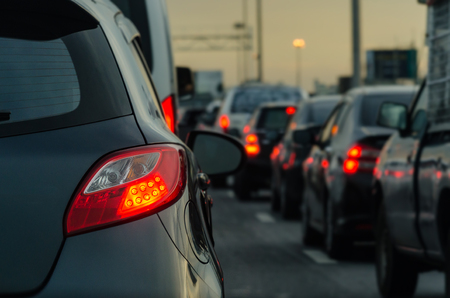 traffic jam with row of cars on expressway during rush hour