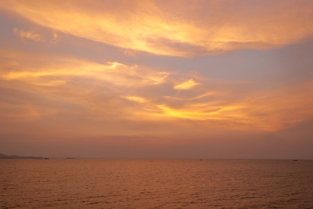 sky at sunset with ocean as background imageの写真素材