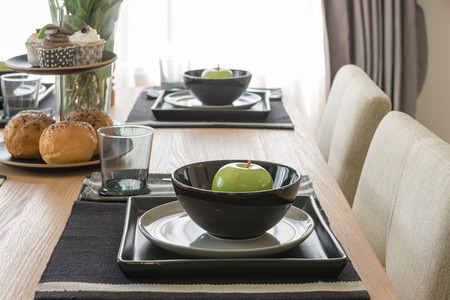 table set on wooden dinning table in modern dinning room design