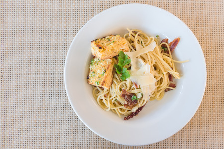Spaghetti Carbonara with bacon and cheese in restaurantの写真素材