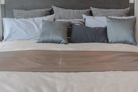 set of black color pillows on luxury bed in bedroom designの写真素材