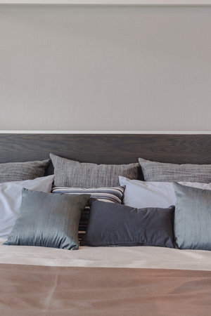 set of black color pillows on luxury bed in bedroom designの写真素材