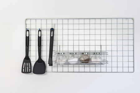 utensils hanging on the wall in kitchen roomの写真素材