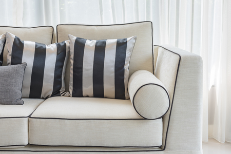 white elegance sofa with black and white pillows in luxury living room designの写真素材