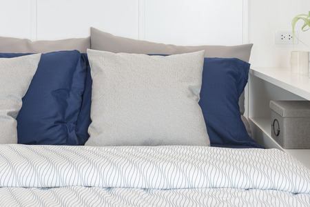 modern bedroom design with blue color set of pillowsの写真素材