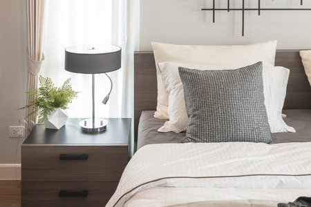 modern bedroom with modern lamp style on wooden table sideの写真素材