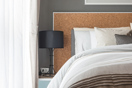 modern black lamp on table side in modern bedroom designの写真素材
