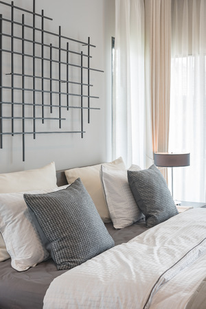 modern bedroom with modern lamp style on wooden table sideの写真素材
