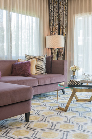 luxury living room design with purple sofa and set of pillowsの写真素材