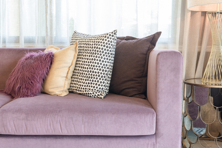 luxury living room design with purple sofa and set of pillowsの写真素材