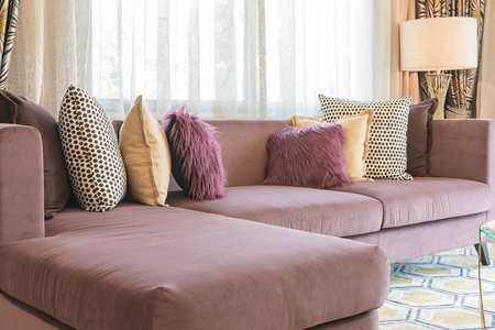 luxury living room design with purple sofa and set of pillowsの写真素材