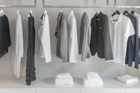 black and white color tone clothes in modern white wardrobeの写真素材