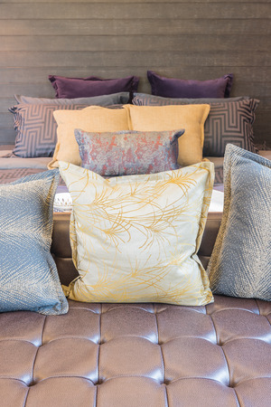 set of pillows on sofa in modern bedroom designの写真素材