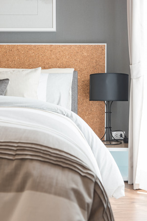 modern black lamp on table side in modern bedroom designの写真素材