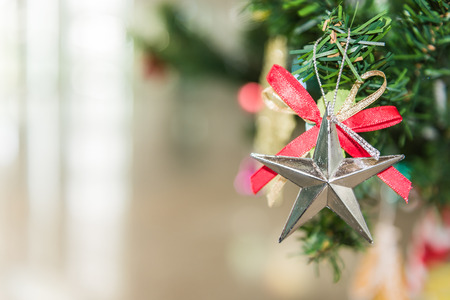 Decorated Christmas tree on blurred, sparkling and fairy backgroundの写真素材