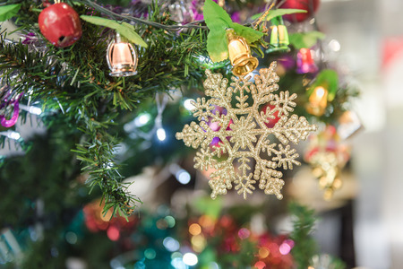 Decorated Christmas tree on blurred, sparkling and fairy backgroundの写真素材