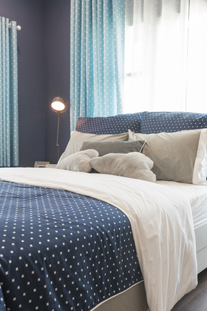 modern blue color tone bedroom interior design with modern lampの写真素材