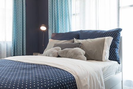 modern blue color tone bedroom interior design with modern lampの写真素材