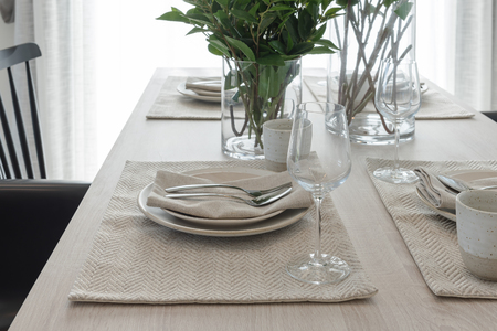 modern dinning room with black modern chair and vase of plant on tableの写真素材