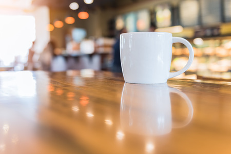 coffee cup in coffee shop - vintage style effect pictureの写真素材