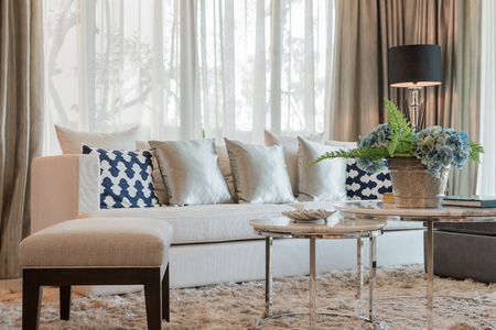 set of pillows and sofa in classic living room syle with black lampの写真素材