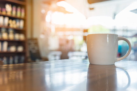 coffee cup in coffee shop - vintage style effect pictureの写真素材