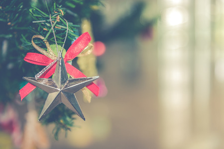 Decorated Christmas tree on blurred, sparkling and fairy backgroundの写真素材