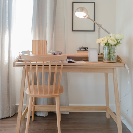 wooden chair and table with modern lamp in working space interior designの写真素材