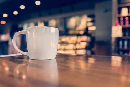 coffee cup in coffee shop - vintage style effect pictureの写真素材