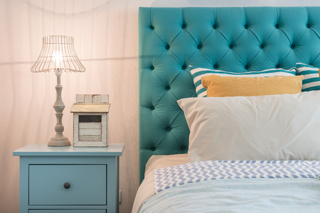 modern colorful bedroom design with lamp on blue table sideの写真素材