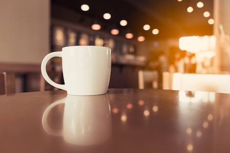 coffee cup in coffee shop - vintage style effect pictureの写真素材