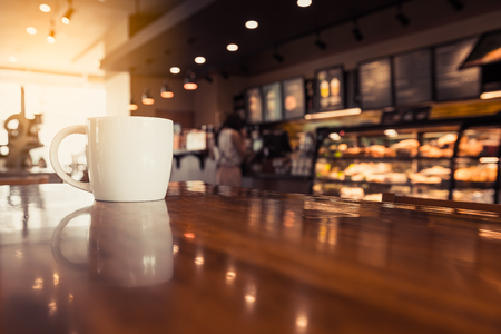 coffee cup in coffee shop - vintage style effect pictureの写真素材