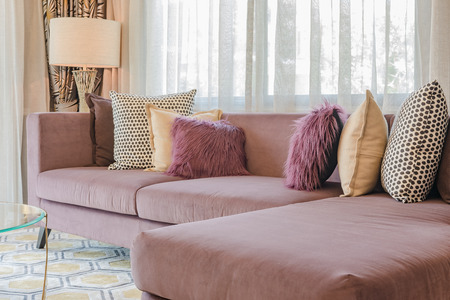 luxury living room design with purple sofa and set of pillowsの写真素材