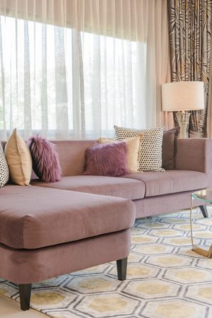 luxury living room design with purple sofa and set of pillowsの写真素材