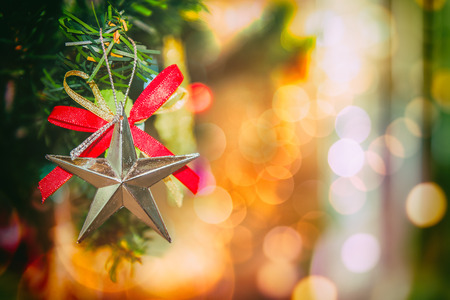 Decorated Christmas tree on blurred, sparkling and fairy backgroundの写真素材