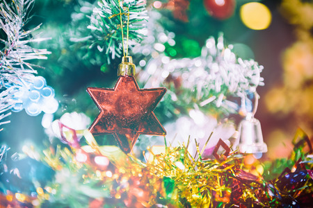 Decorated Christmas tree on blurred, sparkling and fairy backgroundの写真素材