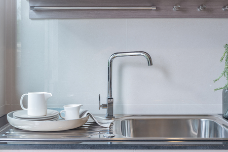 modern kitchen room with sink on top granite counter, interior designの写真素材