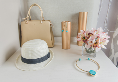white dressing table with women's accessories on topの写真素材