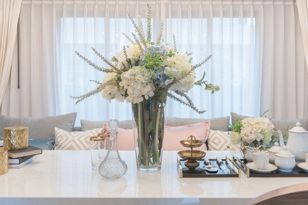 luxury table set on dinnig table with vase of flower in dining room interior designの写真素材