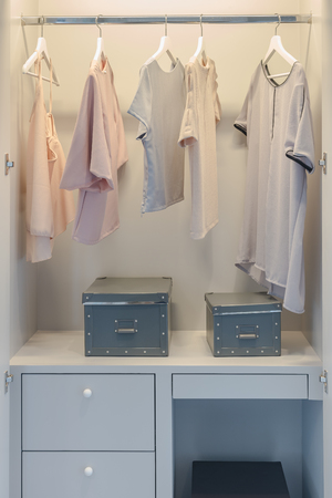 row of clothes hanging in closet, interior designの写真素材